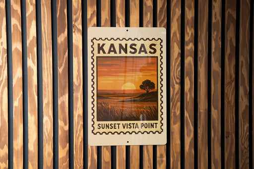 A Kansas sunset stamp sign is displayed on a wooden wall.