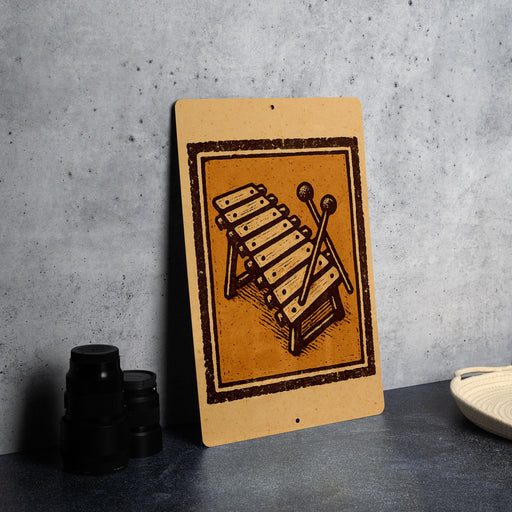 a wooden sign with a musical instrument design, placed on a table next to some black camera lenses.