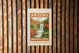A sign for the Waterfall Loop in Arizona is displayed on a wooden wall.