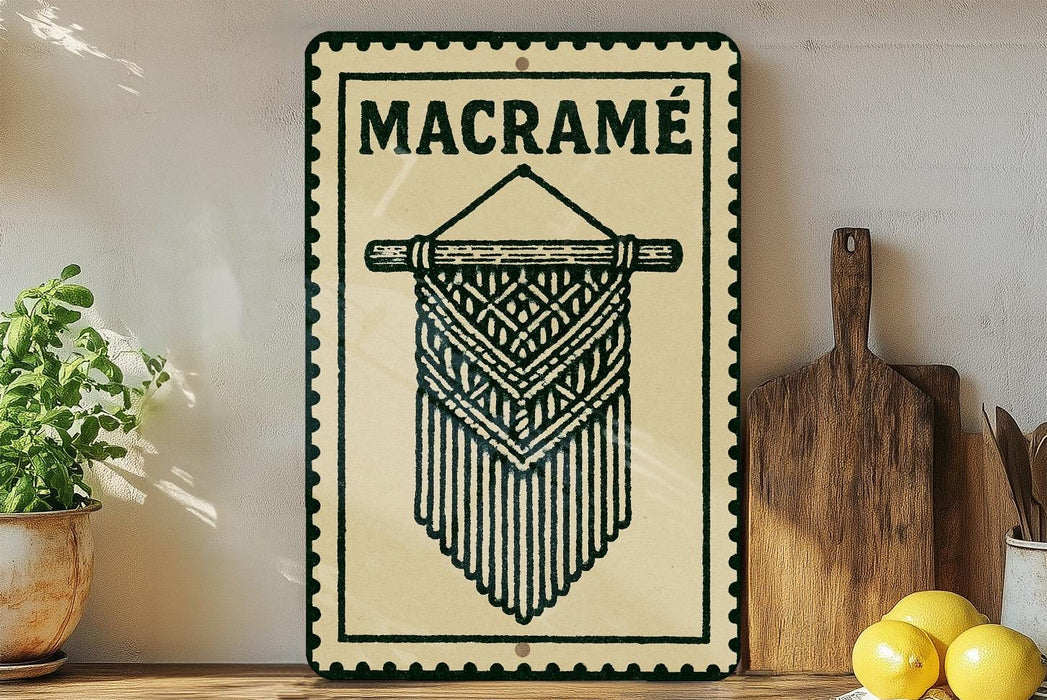 a decorative sign with a macrame design, placed on a wooden surface next to a wooden cutting board and some lemons.