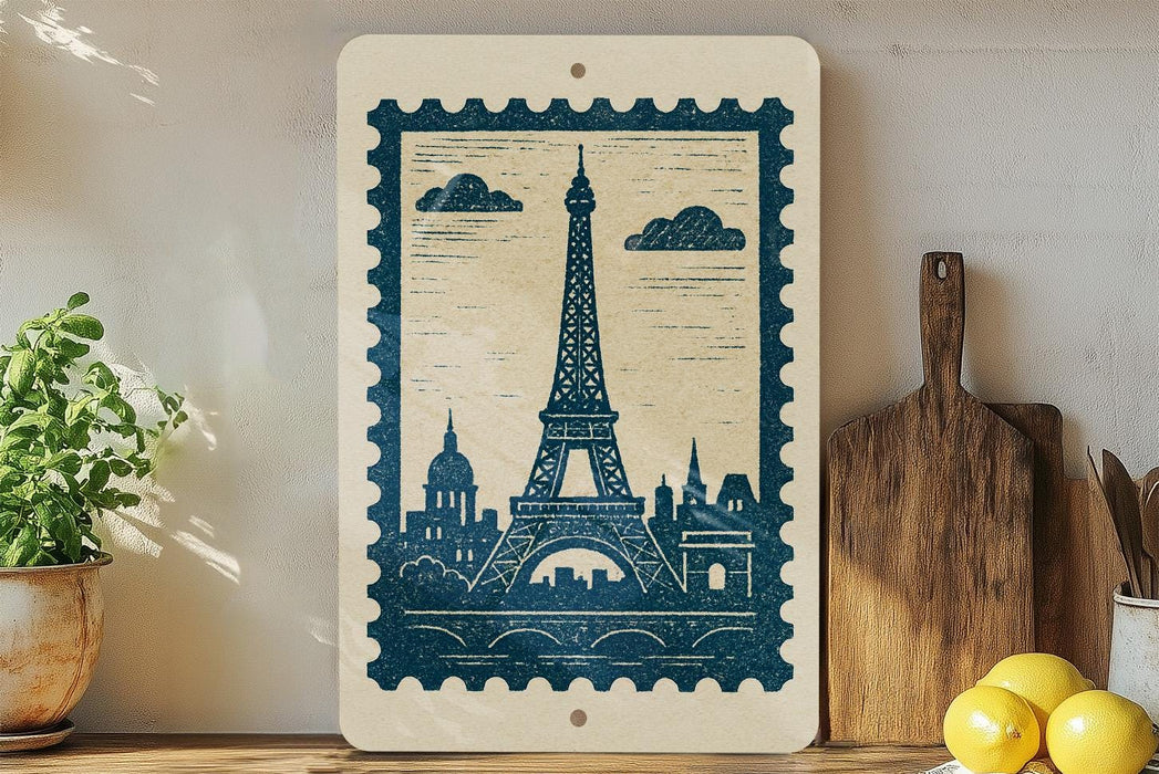 a framed print of the Eiffel Tower on a shelf, surrounded by various kitchen utensils and a potted plant.