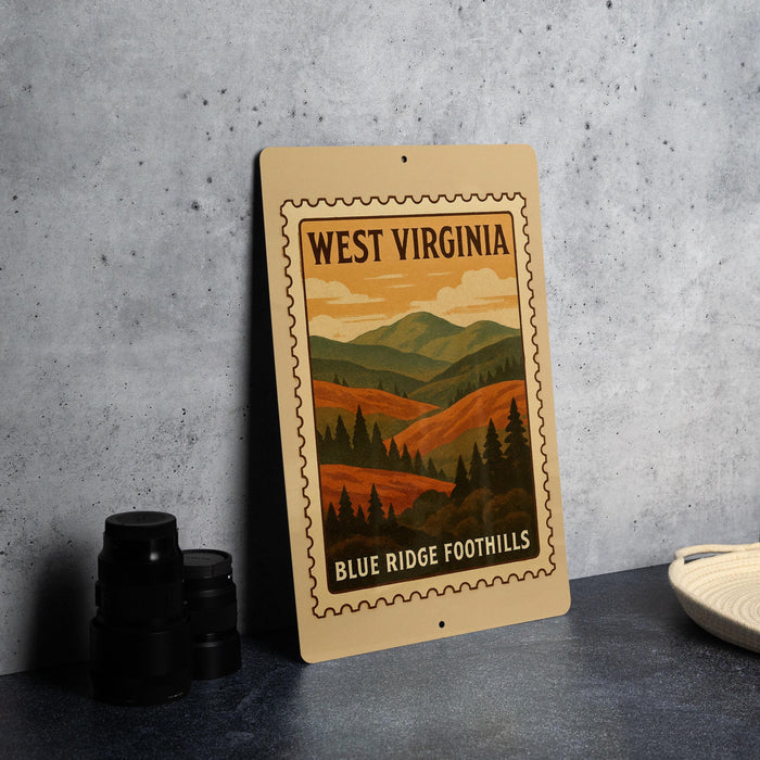 A framed poster of West Virginia's Blue Ridge Foothills, featuring a scenic mountain landscape, is displayed on a countertop.