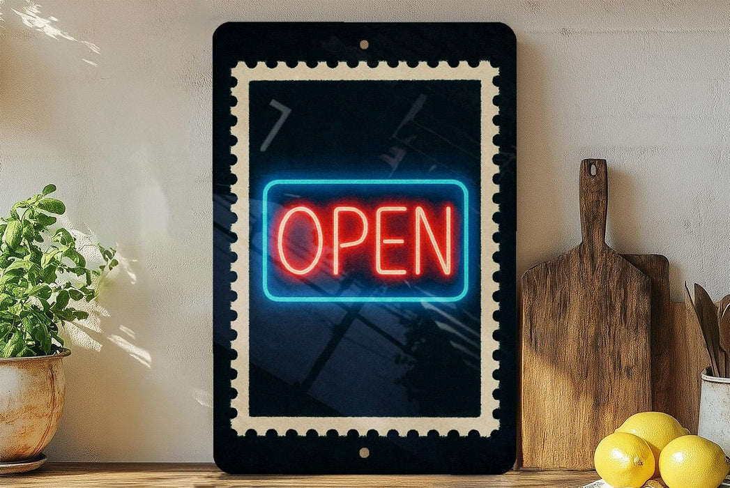 a neon sign that says "OPEN" in red and blue colors, displayed on a black frame. The sign is placed on a wooden surface, with a potted plant, a wooden cutting board, and some lemons nearby.