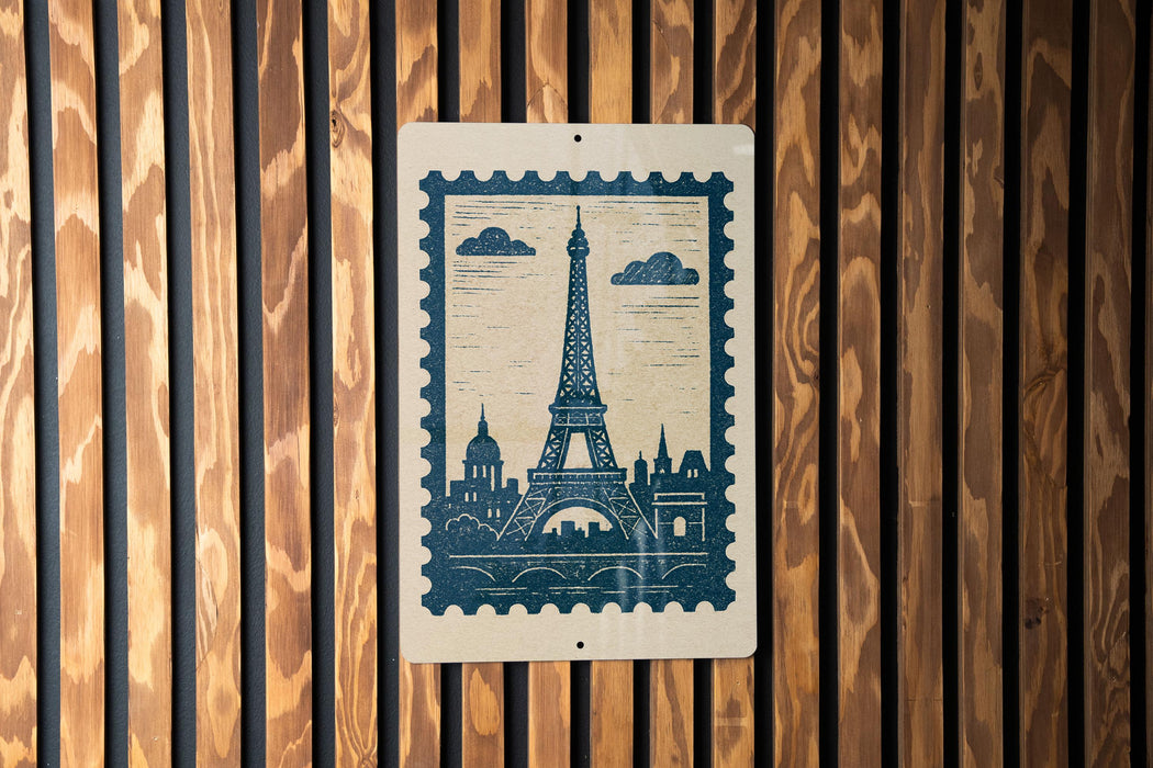 A blue postage stamp featuring the Eiffel Tower is displayed on a wooden wall.