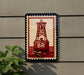 a red buoy with the letter "B" on it, mounted on a wall.