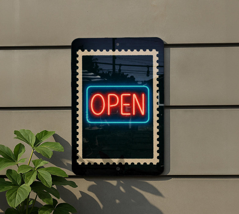 A neon "OPEN" sign is displayed on a wall, with a plant visible to the left side of the frame.