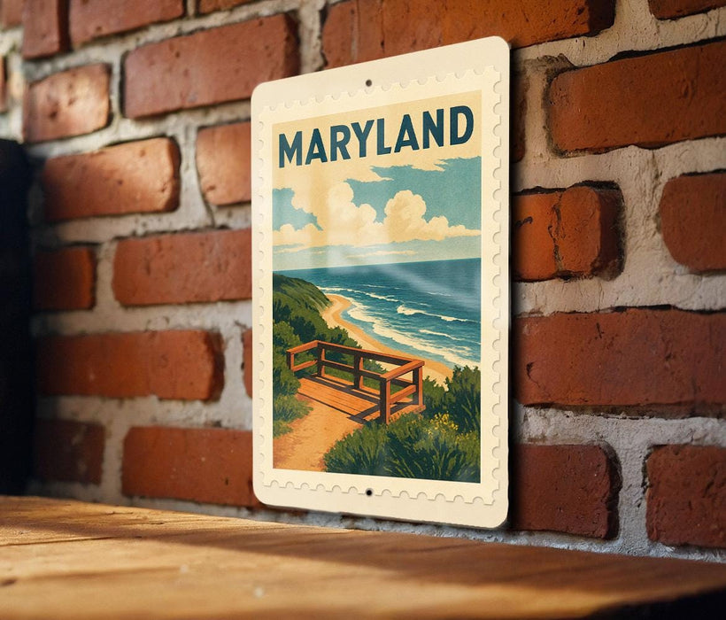 A framed poster of a scenic beach view in Maryland is hanging on a brick wall.