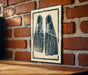 a sign with a pair of flippers on it, mounted on a brick wall.