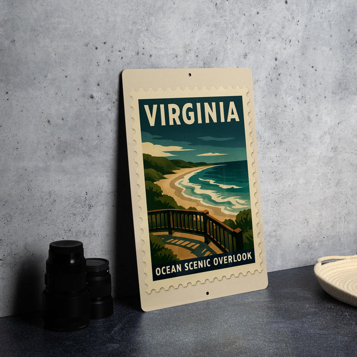 A framed poster of a scenic ocean view, with the word "VIRGINIA" prominently displayed, is placed on a countertop next to some black camera lenses.