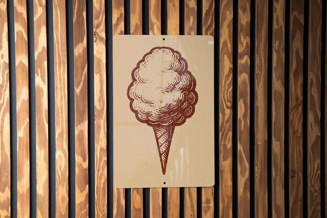 a sign with a drawing of a cotton candy cone.