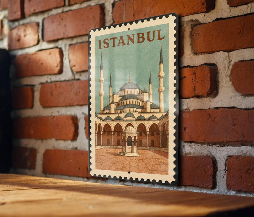 A vintage postage stamp featuring the Blue Mosque in Istanbul, Turkey, is displayed on a brick wall.
