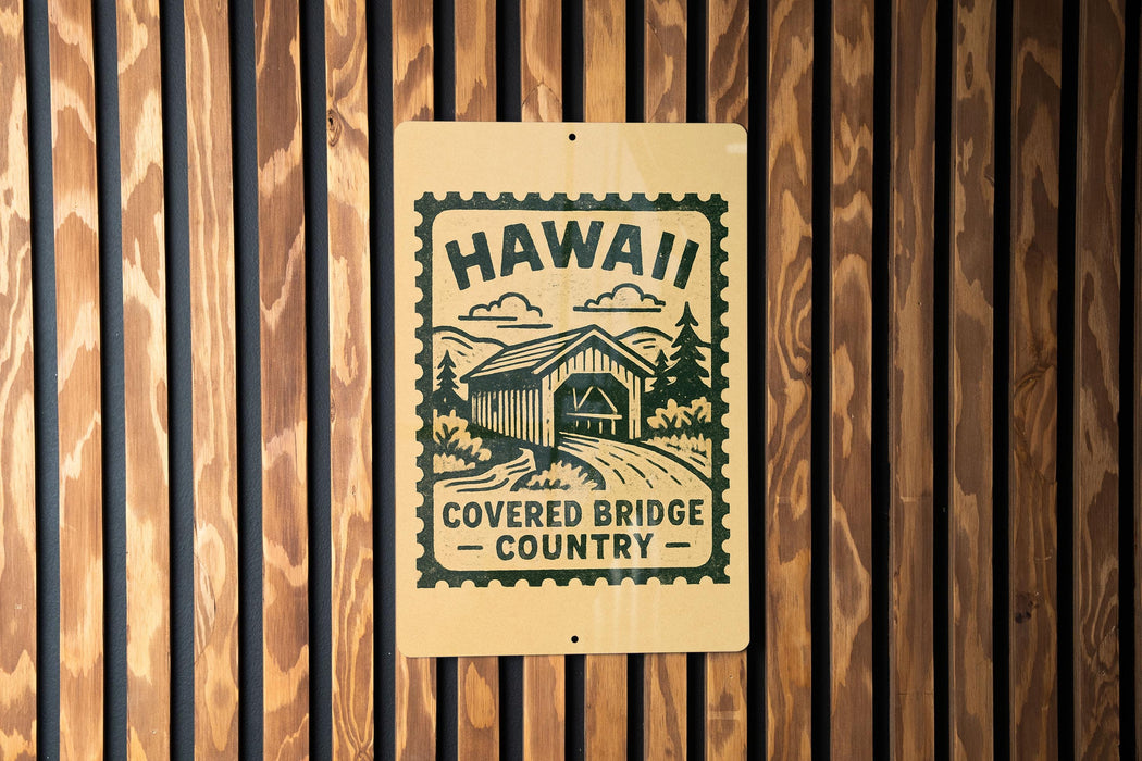 A sign for the Covered Bridge Country in Hawaii, featuring a graphic of a bridge and the text "Hawaii Covered Bridge Country".