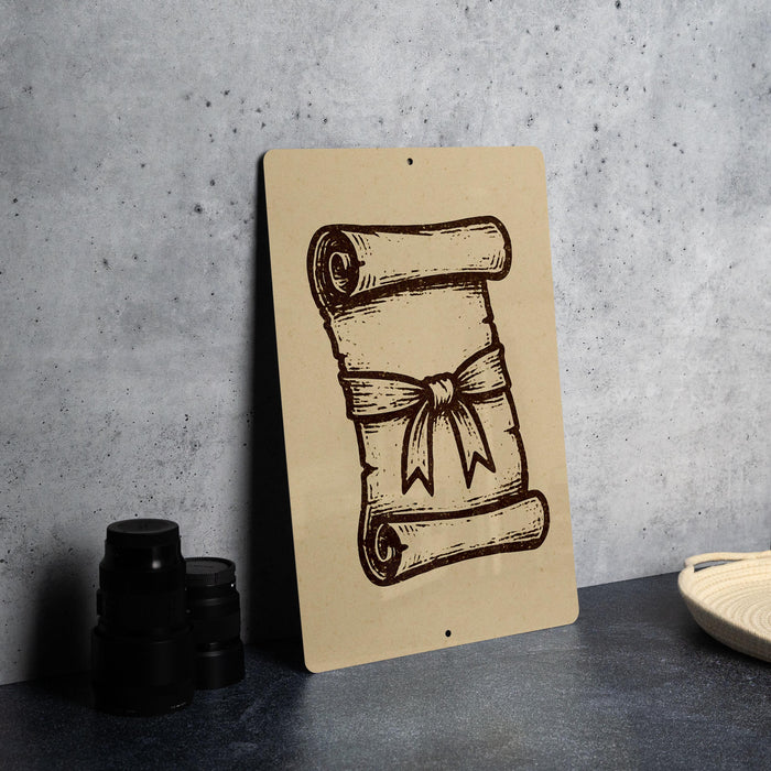 a brown scroll with a bow on it, placed on a gray countertop next to some black camera lenses.