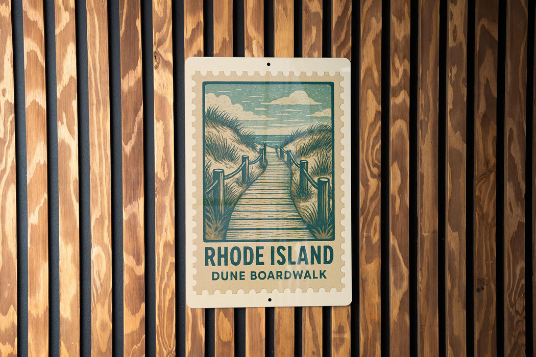 A sign for the Rhode Island Dune Boardwalk is displayed on a wooden wall.