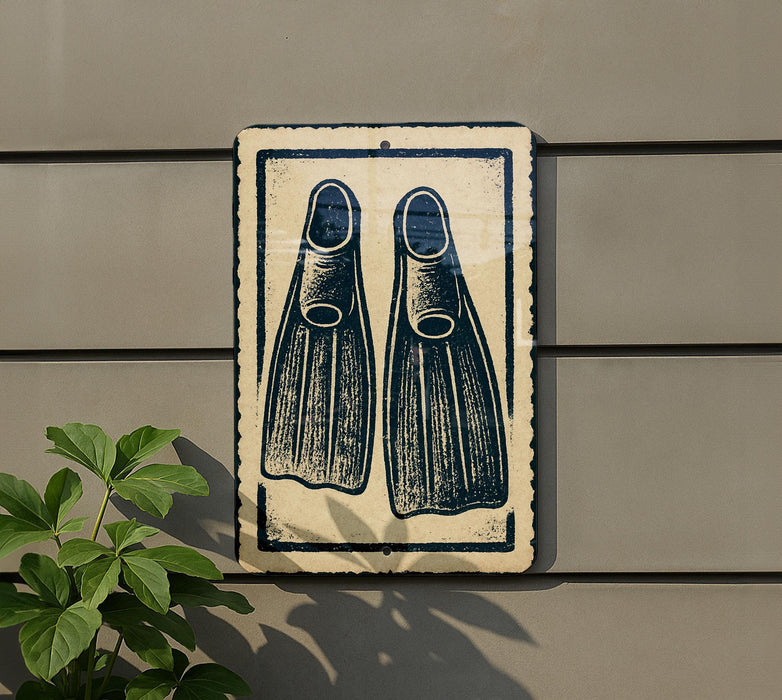 a sign with a pair of flippers on it, mounted on a wall next to a plant.