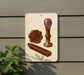 a sign with a vintage-style illustration of a wax seal, a wax stamp, and a wax cutter on a white background.