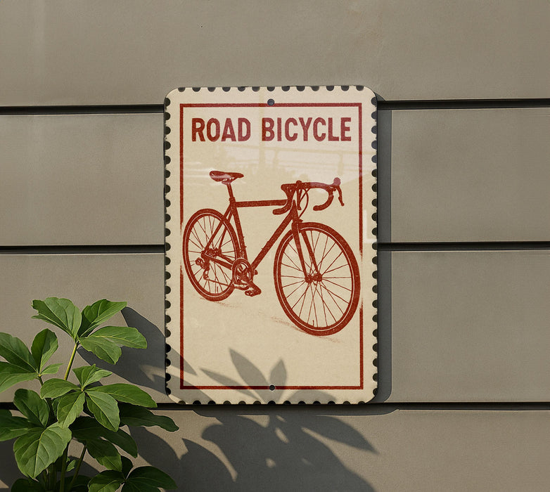 a sign that reads "Road Bicycle" with a red bicycle illustration on it.