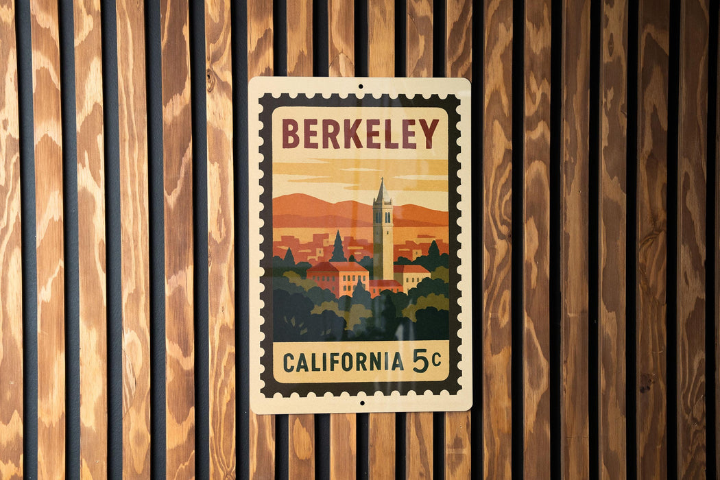 A vintage postage stamp from California, featuring a cityscape and a tower, is displayed on a wooden wall.