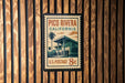 A postage stamp for Pico Rivera, California, with a palm tree and building illustration.