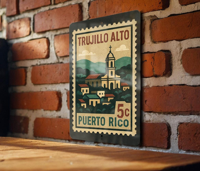 A vintage postage stamp featuring a church and a village, mounted on a brick wall.
