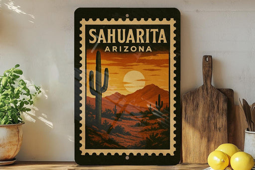 a framed poster of a desert landscape with a cactus and mountains in the background, placed on a shelf next to a wooden cutting board and some lemons.