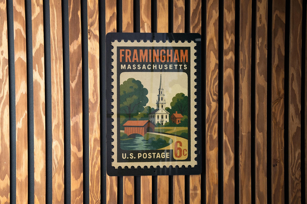 Framingham, Massachusetts postage stamp on a wooden wall.