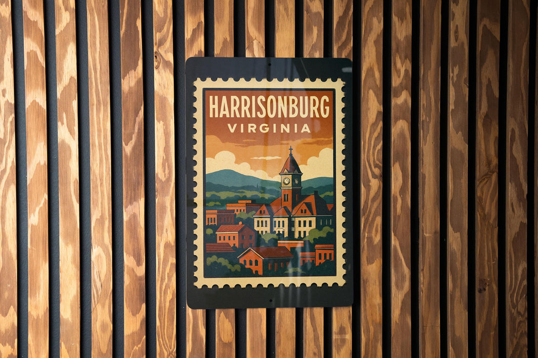 A vintage-style postage stamp depicting a town with a church, hanging on a wooden wall.