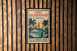 A vintage U.S. postage stamp from Fort Lauderdale, Florida, featuring a palm tree and a boat on the water.