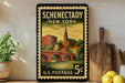 A vintage U.S. postage stamp from Schenectady, New York, featuring a scenic illustration of the town and a bridge.