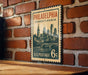 A vintage-style postage stamp from the United States, featuring the Philadelphia skyline and the text "PHILADELPHIA PENNSYLVANIA 6c U.S. POSTAGE".