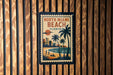A vintage-style poster of North Miami Beach, Florida, featuring palm trees, a beach scene, and a cityscape.