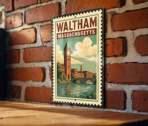 A vintage-style metal sign with the text "WALTHAM MASSACHUSETTS" and an illustration of a clock tower and a bridge, mounted on a brick wall.