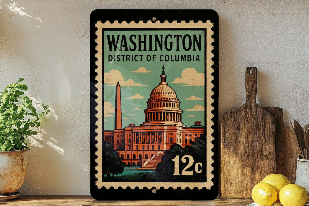 A framed vintage-style stamp depicting the Washington, D.C. District of Columbia, with a depiction of the Capitol building and the Washington Monument.