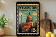 A framed vintage-style stamp depicting the Washington, D.C. District of Columbia, with a depiction of the Capitol building and the Washington Monument.