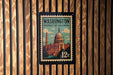 A vintage-style postage stamp from Washington, D.C., featuring the iconic United States Capitol building.