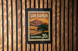 A framed vintage postage stamp from San Ramon, California, featuring a landscape with mountains and a tree.