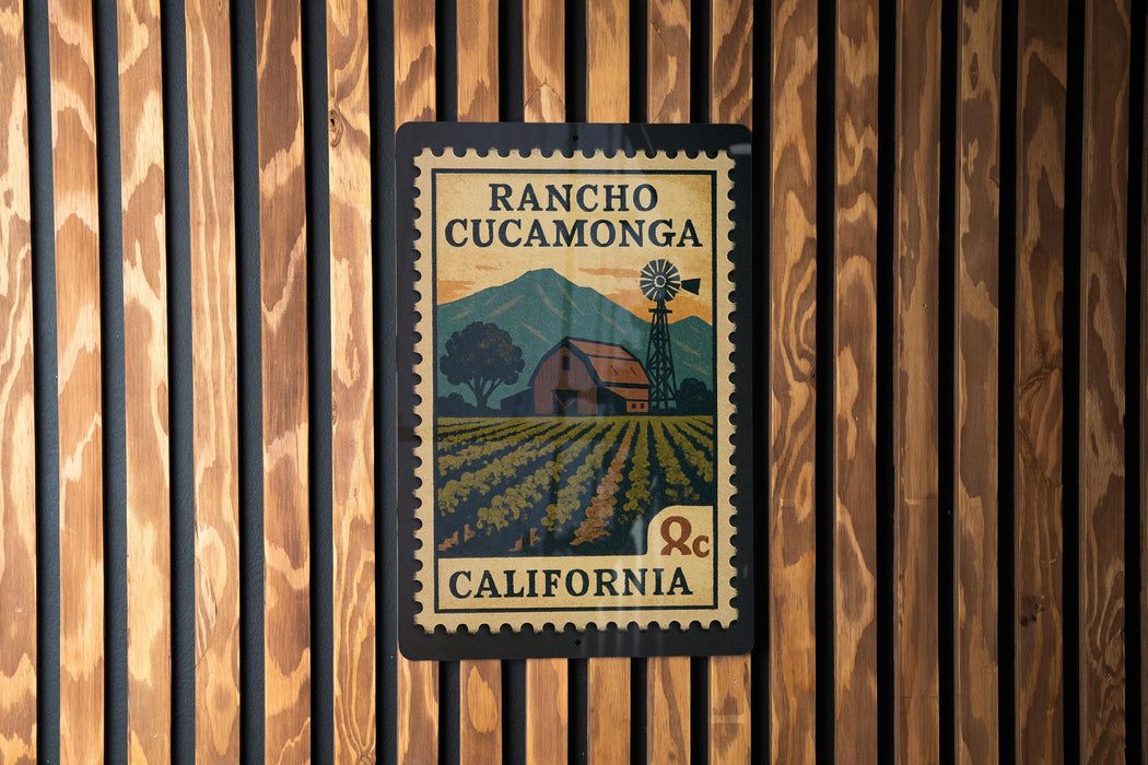 A vintage-style postage stamp from Rancho Cucamona, California, featuring a farm scene and a windmill.