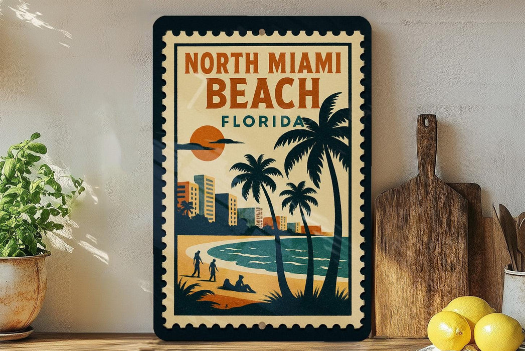 A framed poster of North Miami Beach, Florida, featuring a beach scene with palm trees, a sunset, and a city skyline in the background.