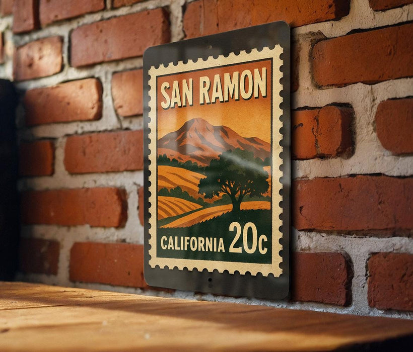 A metal sign with a vintage-style illustration of a landscape, mounted on a brick wall.