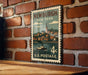 A vintage postage stamp from New York featuring a boat on the water, mounted on a brick wall.
