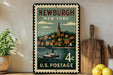 A vintage postage stamp depicting the town of Newburgh, New York, with a steamboat in the water.