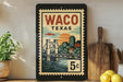 A framed vintage-style stamp depicting a bridge and cityscape in Waco, Texas, with the text "Waco, Texas" and "5c" printed on it.