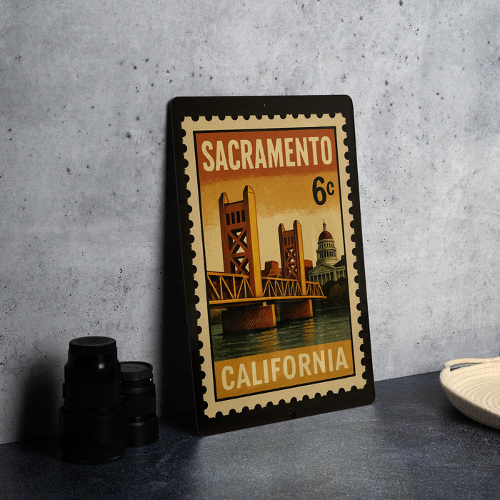A framed vintage postage stamp from Sacramento, California, featuring the iconic Golden Gate Bridge.