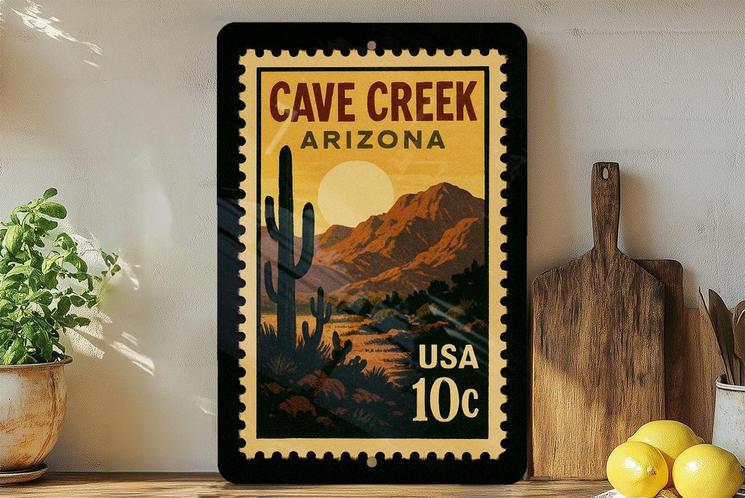 A framed poster of a desert landscape with mountains and a cactus, featuring the text "CAVE CREEK ARIZONA USA 10c" on a wall.