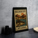 a metal sign with a vintage-style illustration of a fish and mountains, along with the text "Bullhead City Arizona".