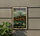 A vintage Newburgh, New York postage stamp is displayed on a wall, featuring a boat and a town scene.
