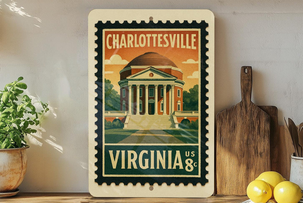 A vintage-style postage stamp depicting the University of Virginia, with a building and a tree in the background, hangs on a wall next to a wooden cutting board and a potted plant.