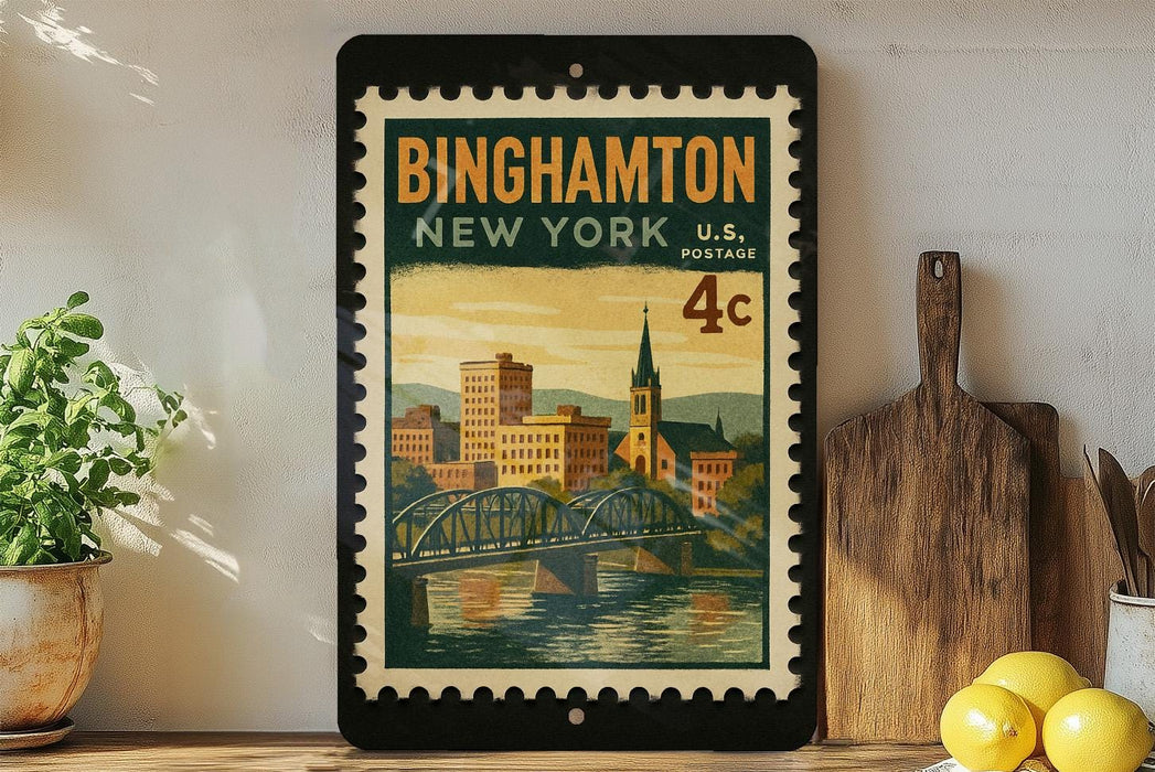 A framed vintage postage stamp from New York, featuring a cityscape and a bridge, is displayed on a shelf next to a wooden cutting board and some lemons.