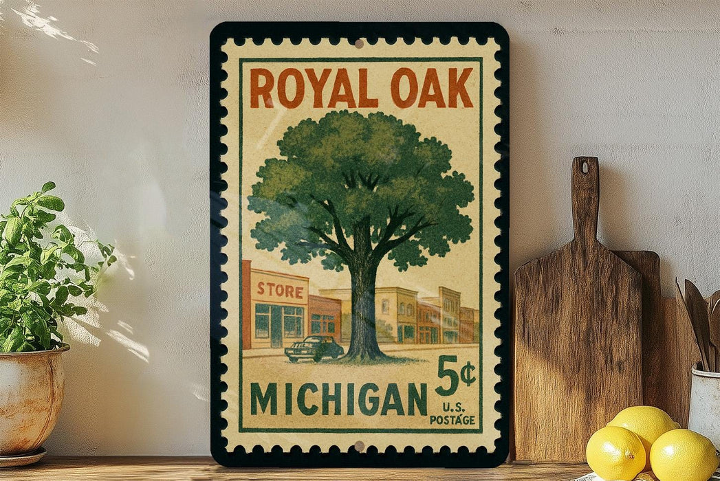 A vintage-style postage stamp featuring a tree and a store, with the text "ROYAL OAK MICHIGAN 5¢ U.S. POSTAGE" printed on it. The stamp is displayed on a wall, with a wooden cutting board and a potted plant visible in the foreground.