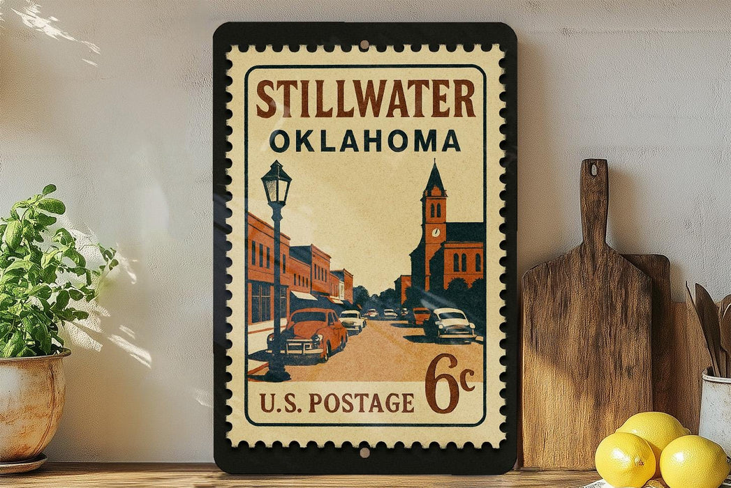 A vintage-style postage stamp from Stillwater, Oklahoma, featuring an illustration of a street scene with a church and buildings.